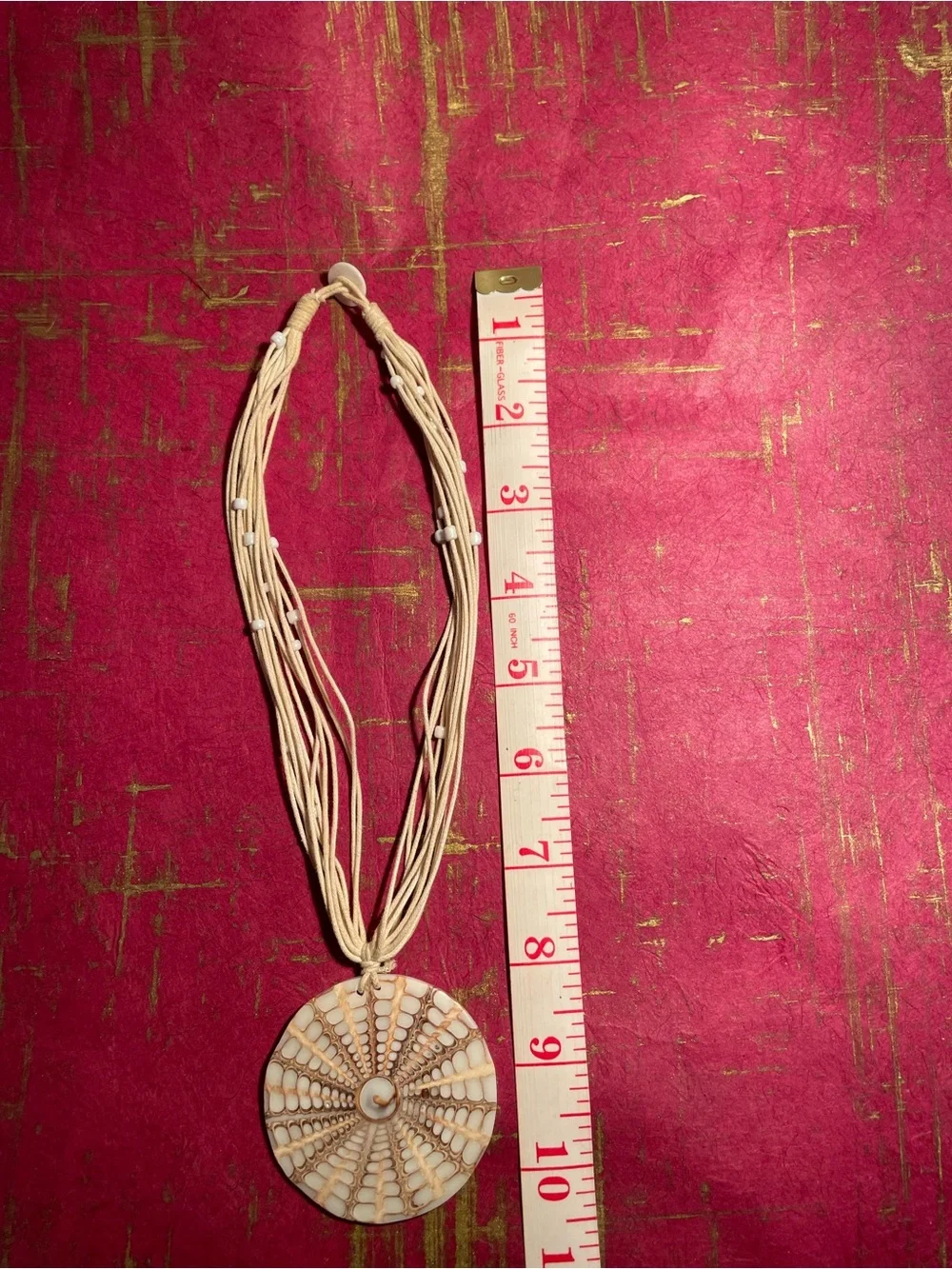 Handcrafted Cream Multi-Strand Necklace with Round Pendant